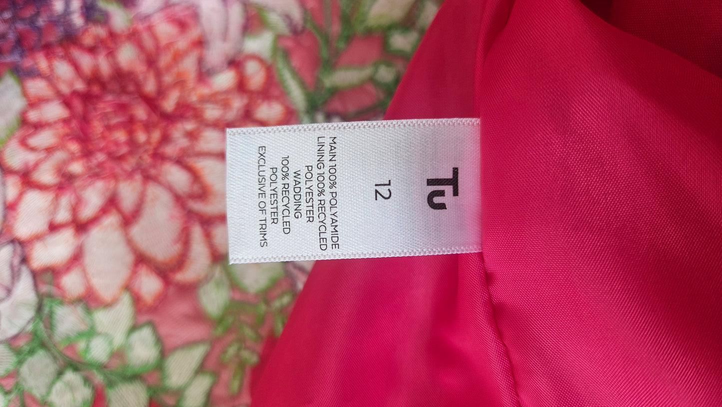 Vibrant pink quilted shower proof jacket with floral embroidery