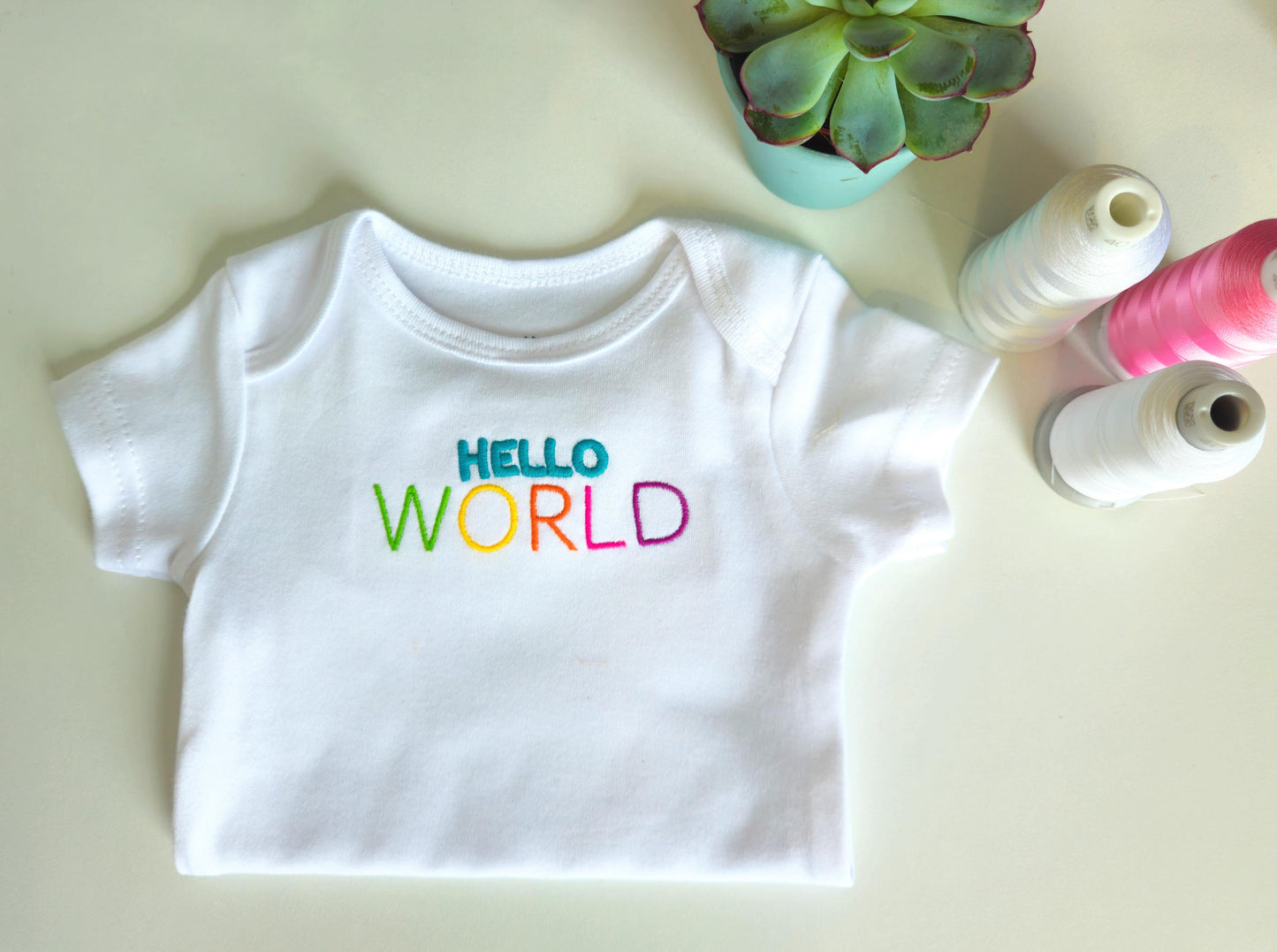Hello WORLD Embroidered Baby Grow and/or Bib | Organic Cotton | New Baby Gift | Gender Neutral | Short Sleeve | white with rainbow text | Onsie
