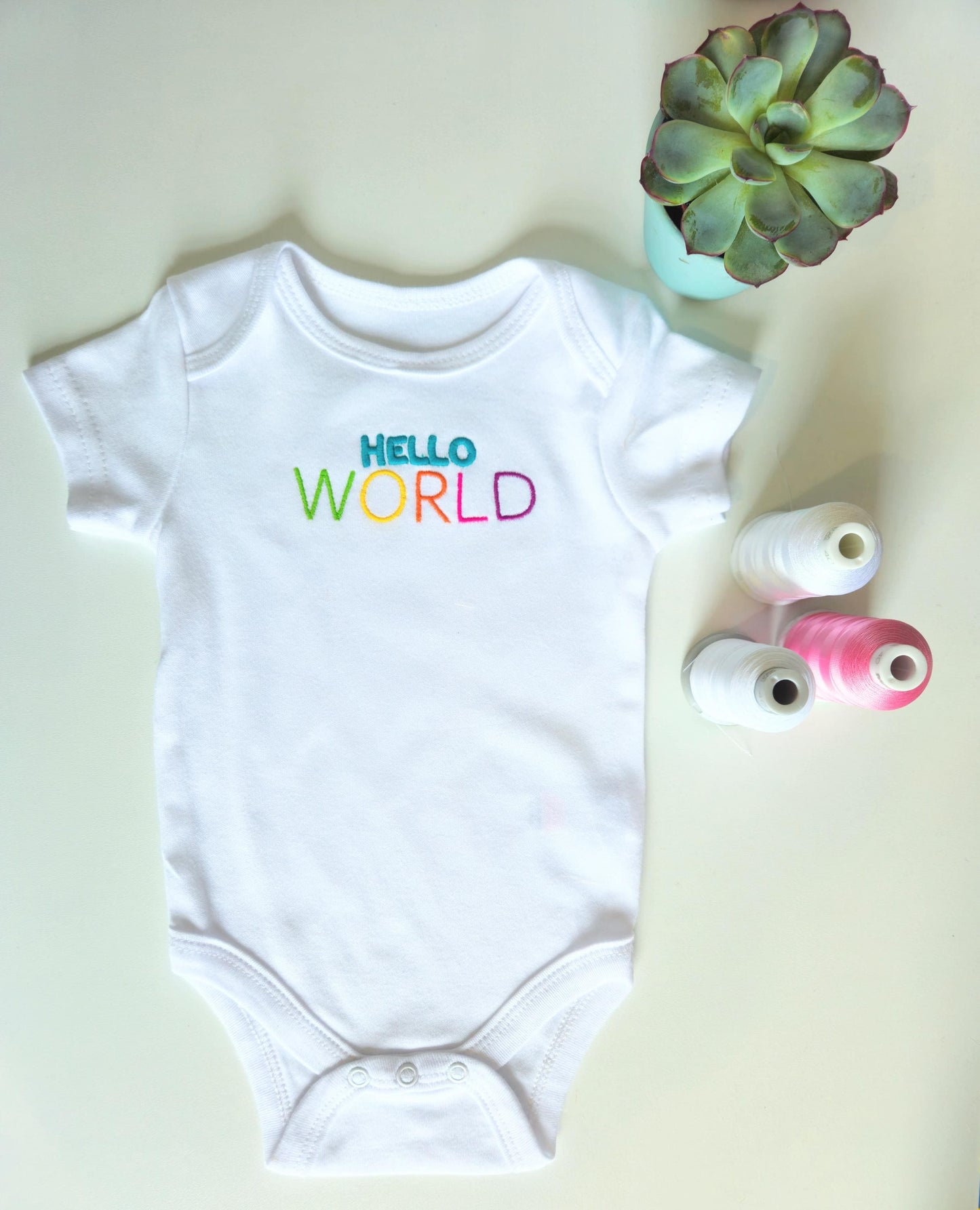 Hello WORLD Embroidered Baby Grow and/or Bib | Organic Cotton | New Baby Gift | Gender Neutral | Short Sleeve | white with rainbow text | Onsie